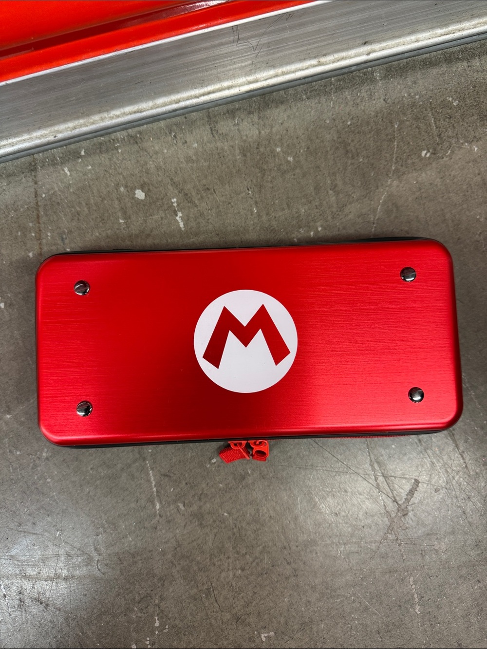 Nintendo Red Metallic Handheld Travel Switch Case with White 'M' Emblem